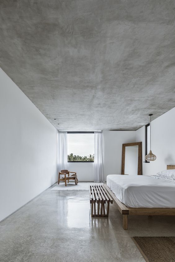 Dormitorio com cimento queimado com verniz acetinado realçando a textura